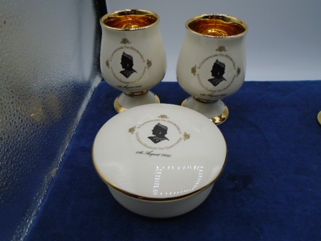 Prink Nash pottery, pair of guilded goblets and dish commemorating queen mothers 80th birthday, in