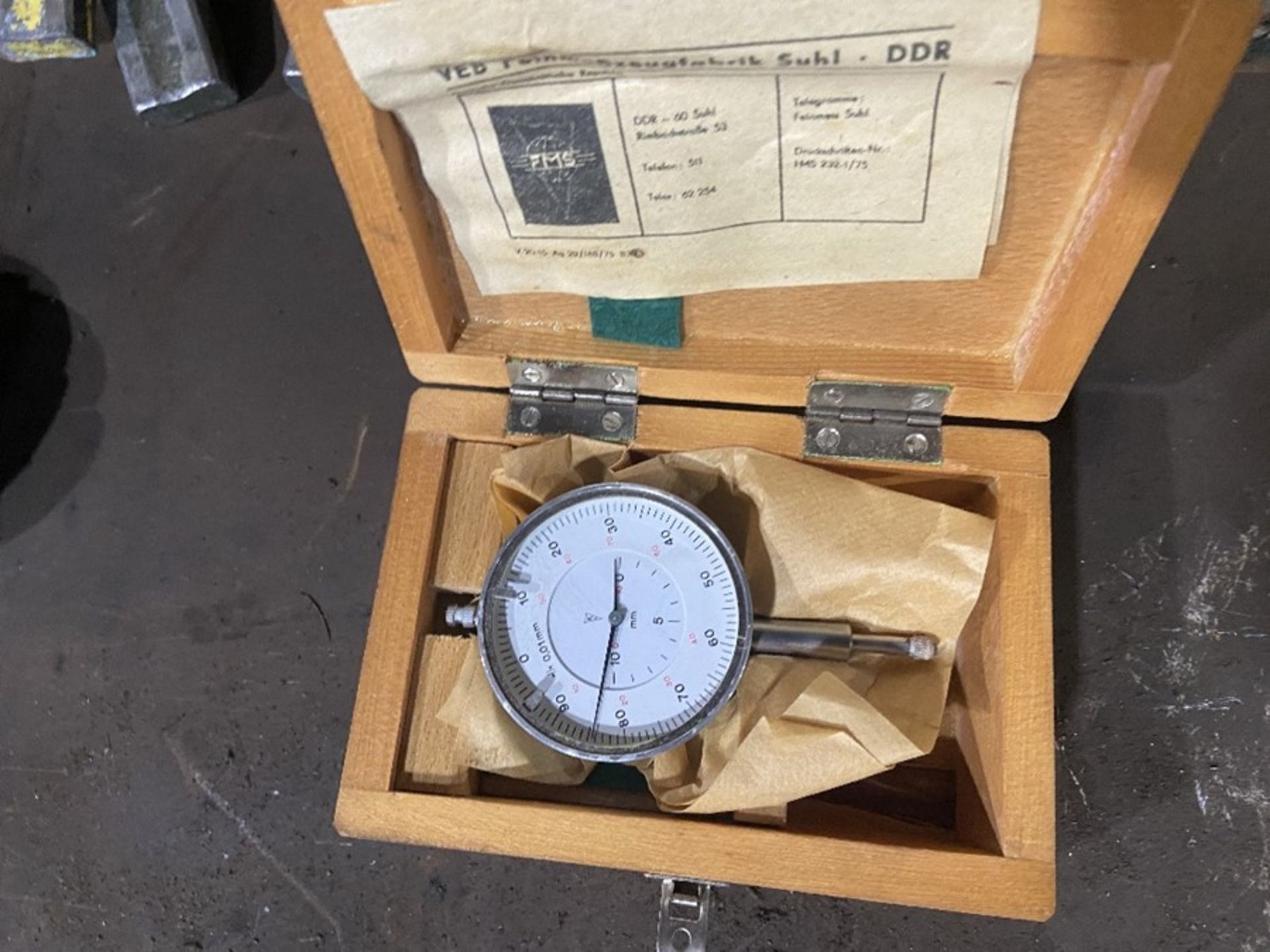 dial gauge in wooden box