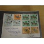 A green 1st Day Covers album, one 1937 and approx 25 1970's and blocks of unused birds (18) plus
