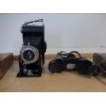 cased binoculars and vintage kodak brownie folding camera with case