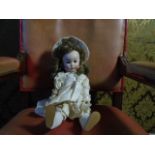 A composite French made doll marked ' Paris SFBJ 247'16 inches dressed in white outfit with