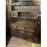 Oak dresser with linen fold design to bottom doors