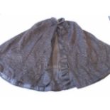 A black patterned Victorian mourning cape, has three hook and eye fastenings with small collar and