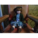 An Edwardian (1909) Schoenail and Hoffmeister composite bisque faced 24 inch doll fully