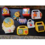 collection of retro musical toys including Tomy, Fisher price, chicco, kiddicraft