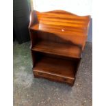 Waterfall bookcase with bottom drawer