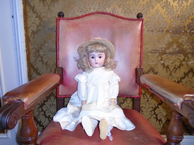 A vintage composite bisque faced doll marked '11' fully articulated with brown sleepy eyes. Possibly