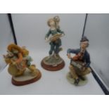 3 figurines with music and cycle theme