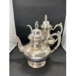 A silver plated coffee pot and tea pot by Oneida Silversmiths (USA). The set of simple form having