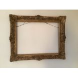 Two gilt picture frames with one canvas stretcher.