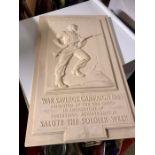 WW II Bakelite wall plaque depicting an advancing soldier with text "For Freedom War Savings