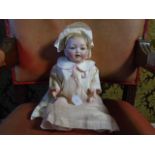 A Composite bisque faced doll by Hertel Schwab marked 152 - 5' - 'Character doll' 'our baby' 14