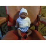 A 17 inch full porcelain body new born doll, marked 'Joyee' on inside leg. slightly loose limbs