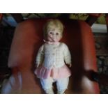 A full body porcelain doll Simsco world of dolls, marked '85 - W' 15 inches dressed in pink and