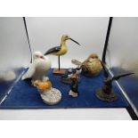 collection of bird ornaments (one is a pie funnel)