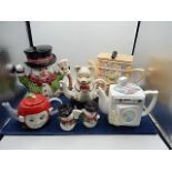 collection of teapots snowman with s&p pots, apple, pig, washing machine