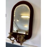 Victorian mirrored wall sconce with velvet surround and beveled mirror with two brass candle holders