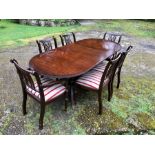 Twin pedestal extending dining table with one leaf and 6 chairs ( 2 are carvers ) all chairs