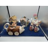 Collection of Teapots 2 cottages, flintstones and duck with matching salt and pepper pots