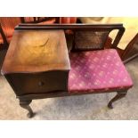 Vintage telephone seat with cane back panel