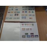2 stock books of stamps from carribean and commonwealth most pages full (photos only show some)