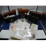 3 vintage Kodak cameras: Kodak Brownie 127 in case, Kodak Anastigmat kodon shutter in stitched