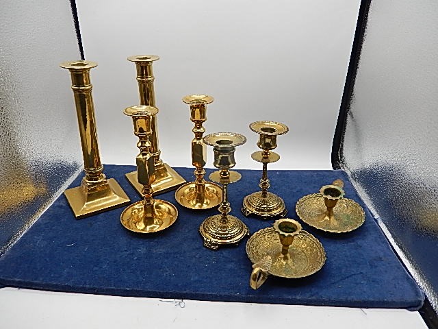 collection of brass candlesticks