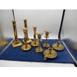 collection of brass candlesticks