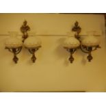 pair of decorative brass wall lights with glass shades