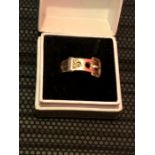 Buckle Ring 9ct gold inset with 3 white stones ( 0ne missing ) 3.6 grams