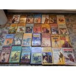 a collection of cowboy books, most by JT Edson