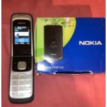 Nokia 2720 Flip mobile phone with charger and box