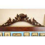 Black Forest carved walnut over mantle / door pediment depicting dogs head with floral apple and