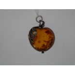 A white metal 'Amber' apple shaped pendant with leaf.