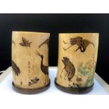 A pair of Japanese Mejii Period carved ivory and shibiyama tusk vases signed with brass bases