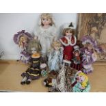 collection of 9 dolls, some china faced, mostly modern