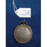 United States 1887 silver dollar in a silver pendant mount