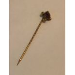 9ct stick pin with red stone