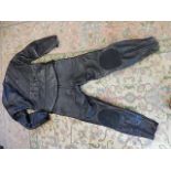 Black 'BKS' motorbike suit, top half unzips to make a 2 piece, no size label