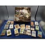 A tin of cigarette cards and 11 cigarette boxes