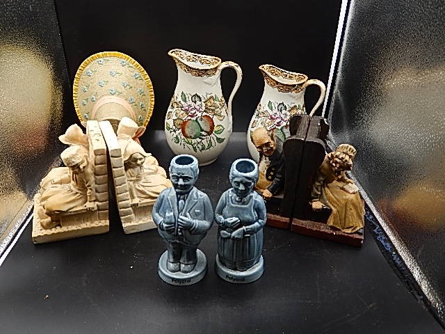 2 sets of bookends, 2 china jugs, 2 polycrol advert figures and blue and white jug and handled dish