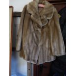 Faux fur coat with hook and eye fastener