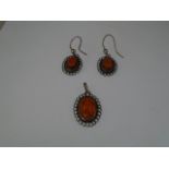 A pair of Silver (marked 925) 'Amber' earrings, with matching pendant.