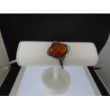 A Silver (marked 'WK' 925) Art Nouveau style 'Amber' bangle with safety catch.