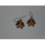 A pair of Silver marked (925) 'Amber' Dolphin earrings