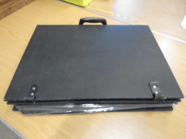 A black carry case with some 25 'pages' of prints- various about 150 in total