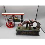 Steam engine model and showjumper cast money box