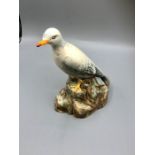 E. Radford, England figure of a Seagull upon a rocky outcrop, 8 1/2" tall