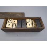 Full set of bone and wood dominoes in box