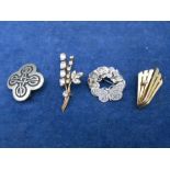 silver brooch, pewter celtic brooch, silver brooch and 2 yellow metal brooch